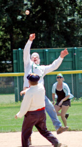 Photo by Larry Ferguson. The Manitou Springers’ Mike Maio goes high in his attempt to catch an errant throw during action against the Star Base Ball Club of Colorado Territory on Aug. 6.