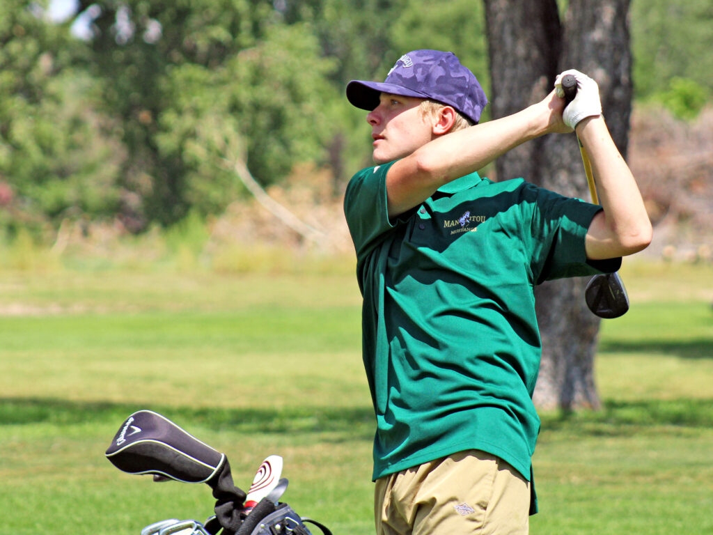 Photo by Daniel Mohrmann. Manitou Springs junior Jack Clifford hits a shot out of the No. 1 fairway at Valley Hi Golf Course on Aug. 22.