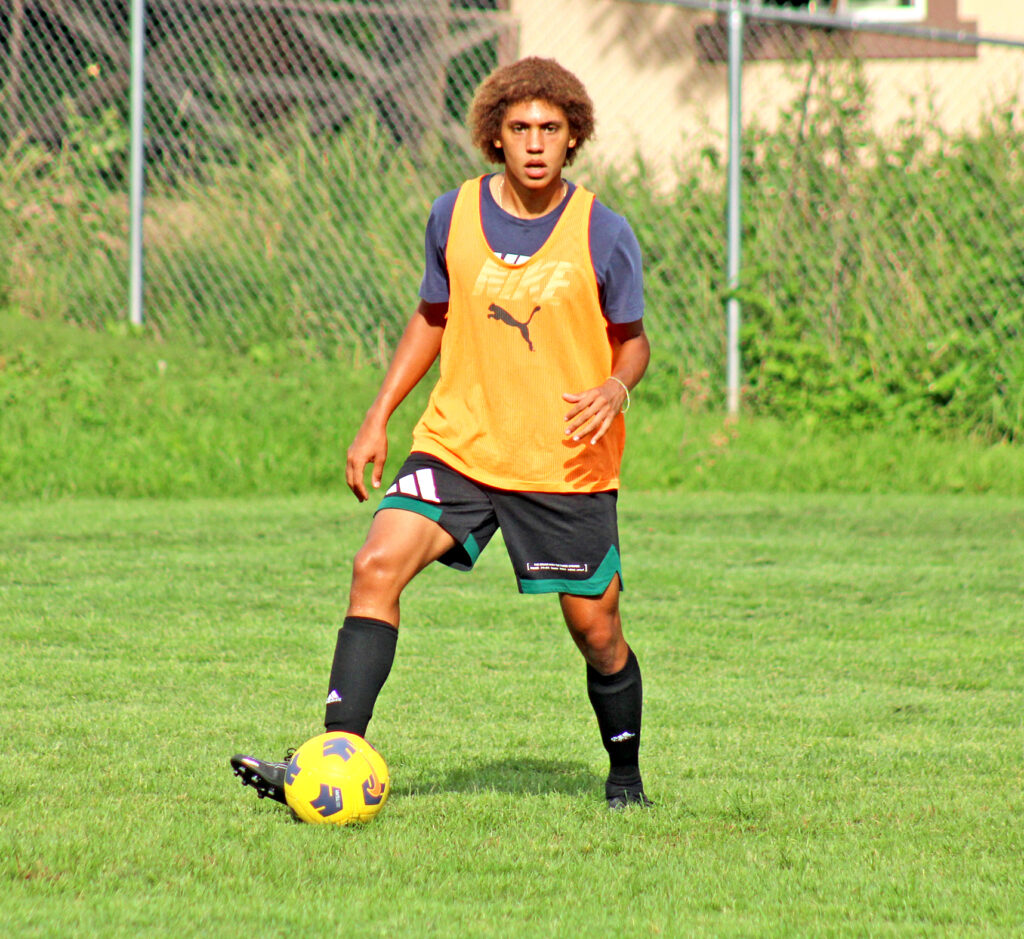 Photo by Daniel Mohrmann . Manitou Springs junior Nick Schneider handles the ball during practice on Aug. 22.