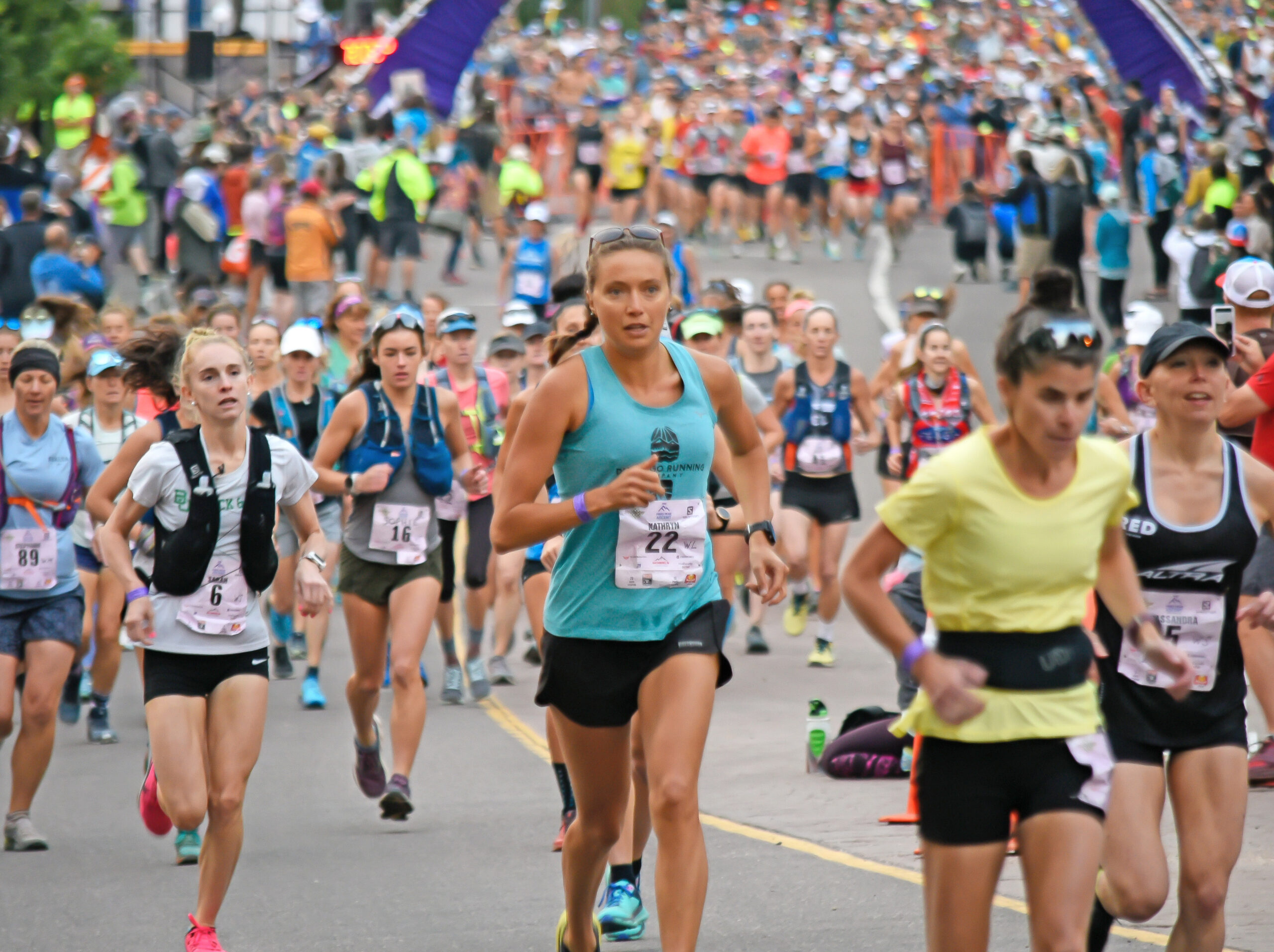 Photo by Bryan Oller. Runners head out from downtown Manitou Springs during a previous race.