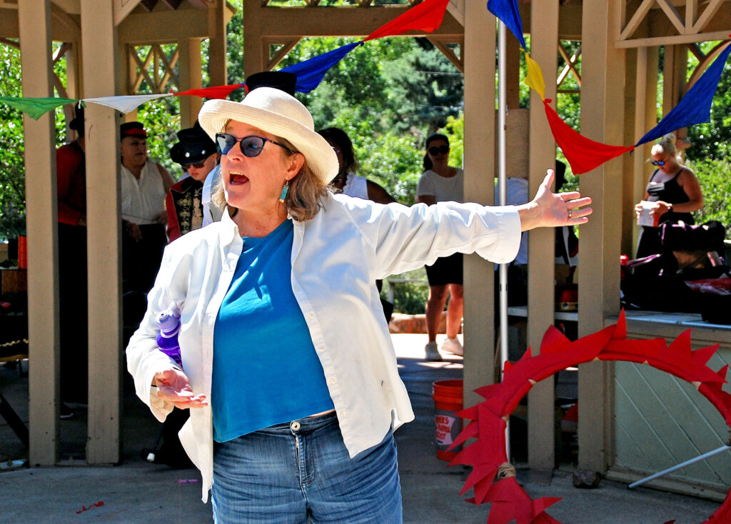 Photo by Rhonda Van Pelt. Molly Wingate of Poetry Heals speaks to the audience during the Saturday, Aug. 27, Dragon Theatre performance.