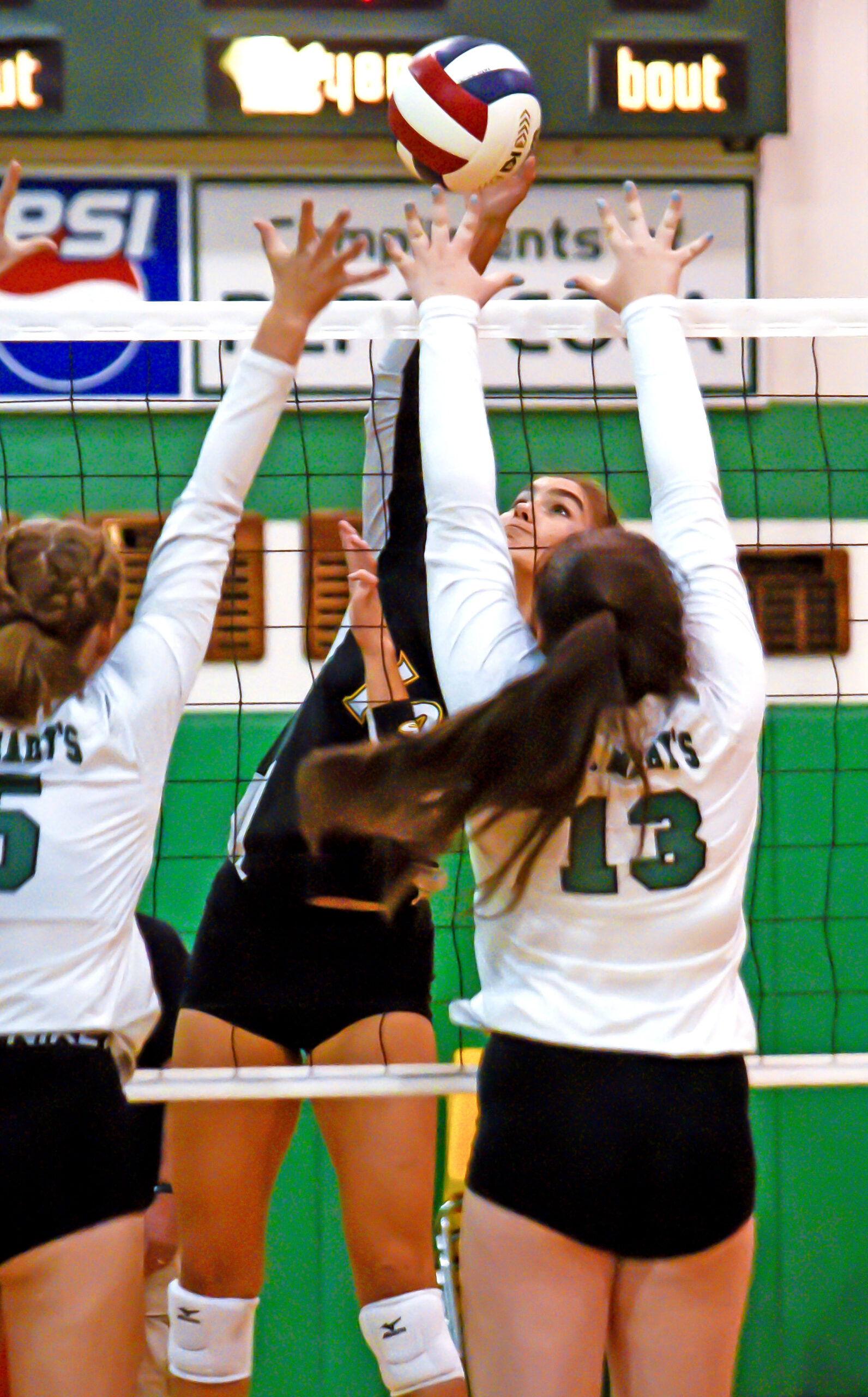 Photo by Bryan Oller. Teryn Thime defends the net during Manitou’s Sept. 13 match against St. Mary’s.