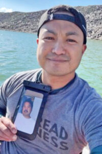 Courtesy image. Ranier Raqueno holds a photo of his beloved father.