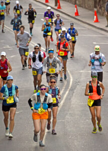 Photo by Bryan Oller. Marathon runners wend their way through downtown Manitou Springs.