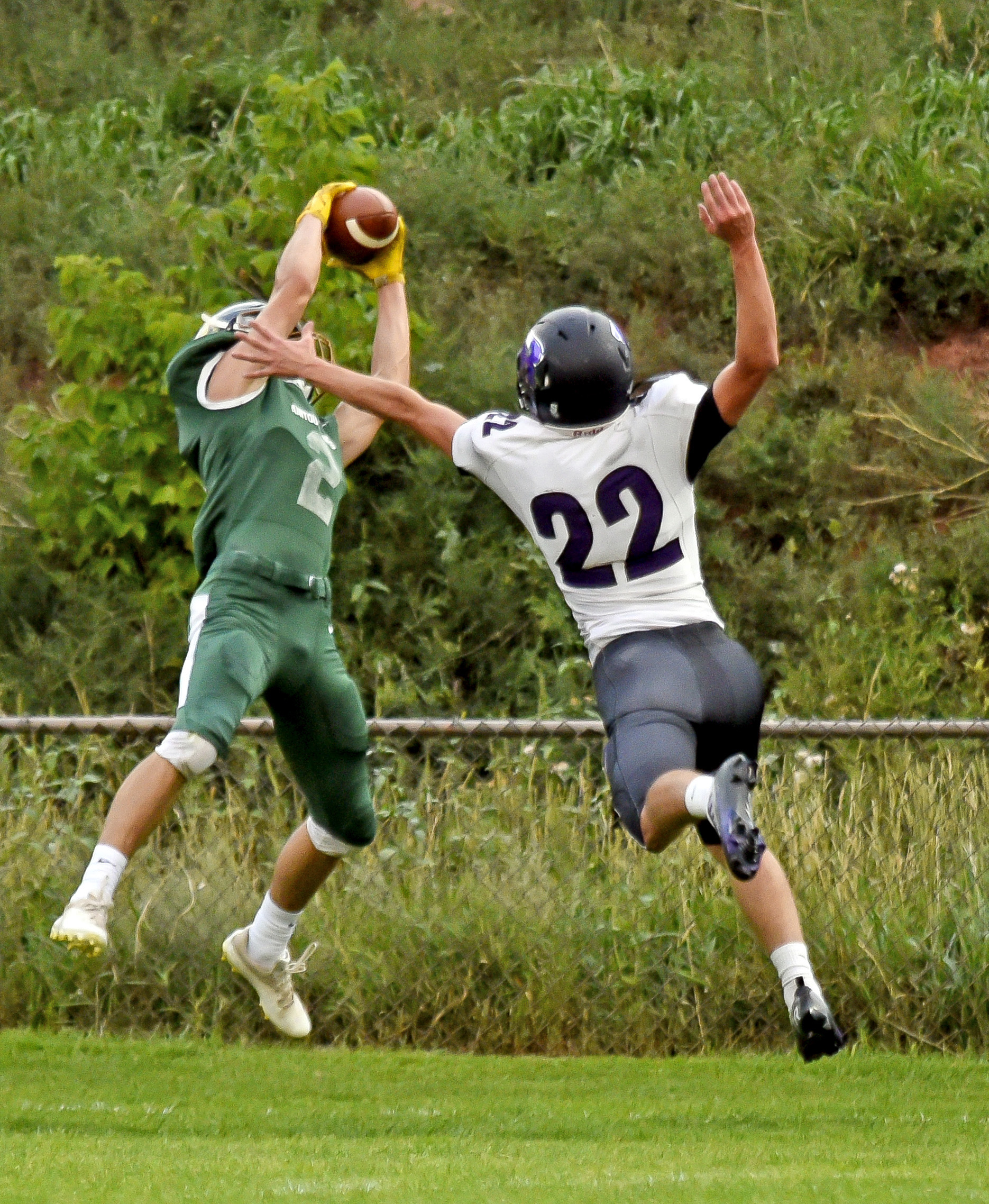 Photo by Bryan Oller. A Rye player goes after Mustang Evan Scherr during their Sept. 2 game.