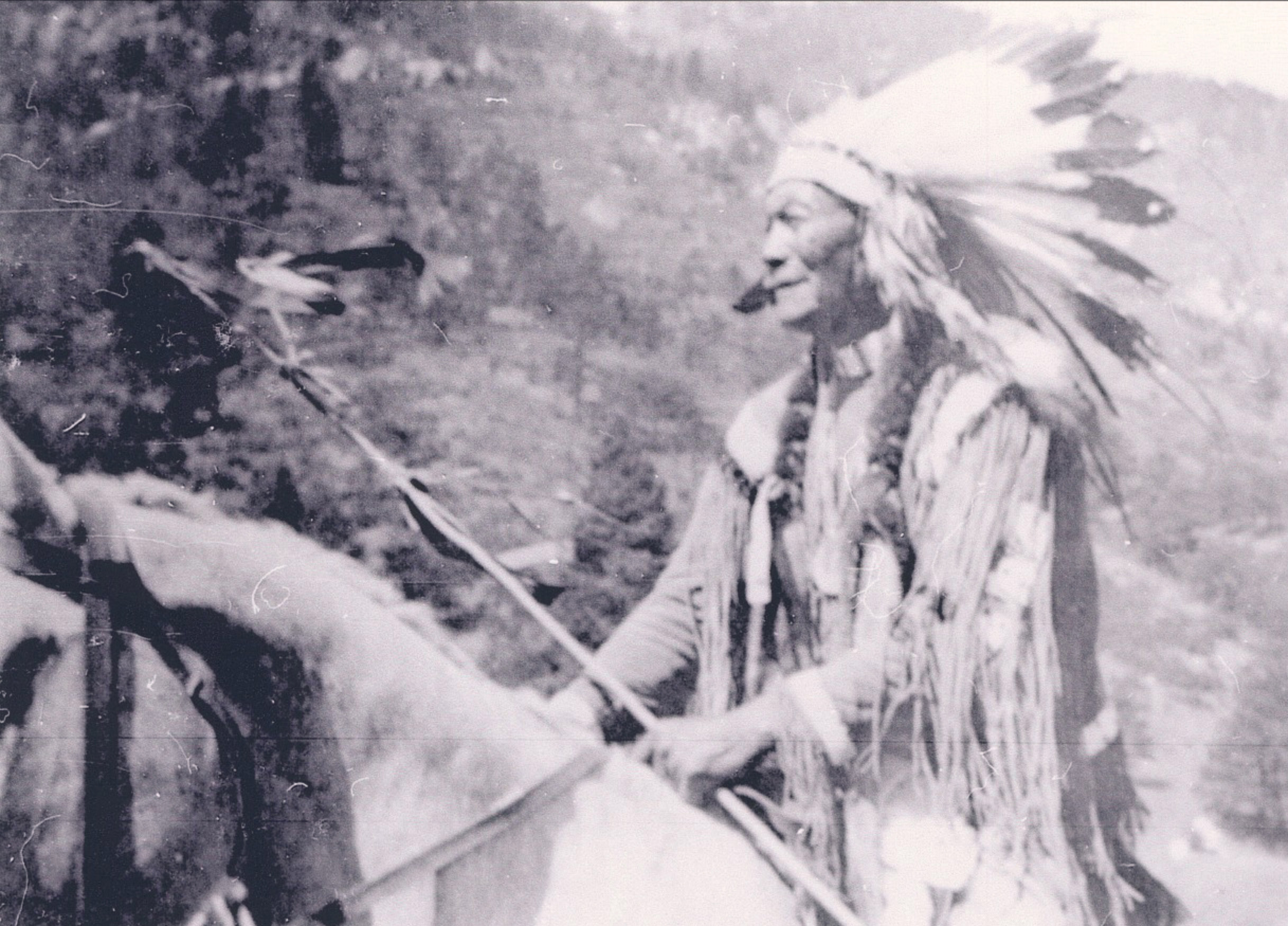 Courtesy image. Chief Nanice rides his horse in this undated photograph. His great-grandson, Kenny Frost, says he wore a war bonnet and eagle feathers in a “trailer” down to his feet.