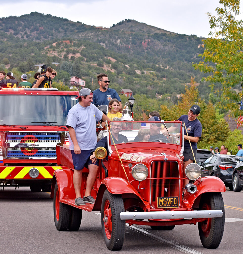 Photo by Rhonda Van Pelt. The Manitou Springs Volunteer Fire Department’s vintage truck led the department’s other trucks on Manitou Avenue.