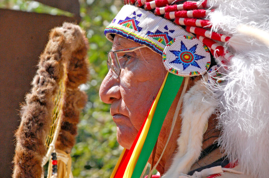 Photo by Rhonda Van Pelt. Jonas Grant Bullethead listens to a speech at 7 Minute Spring.