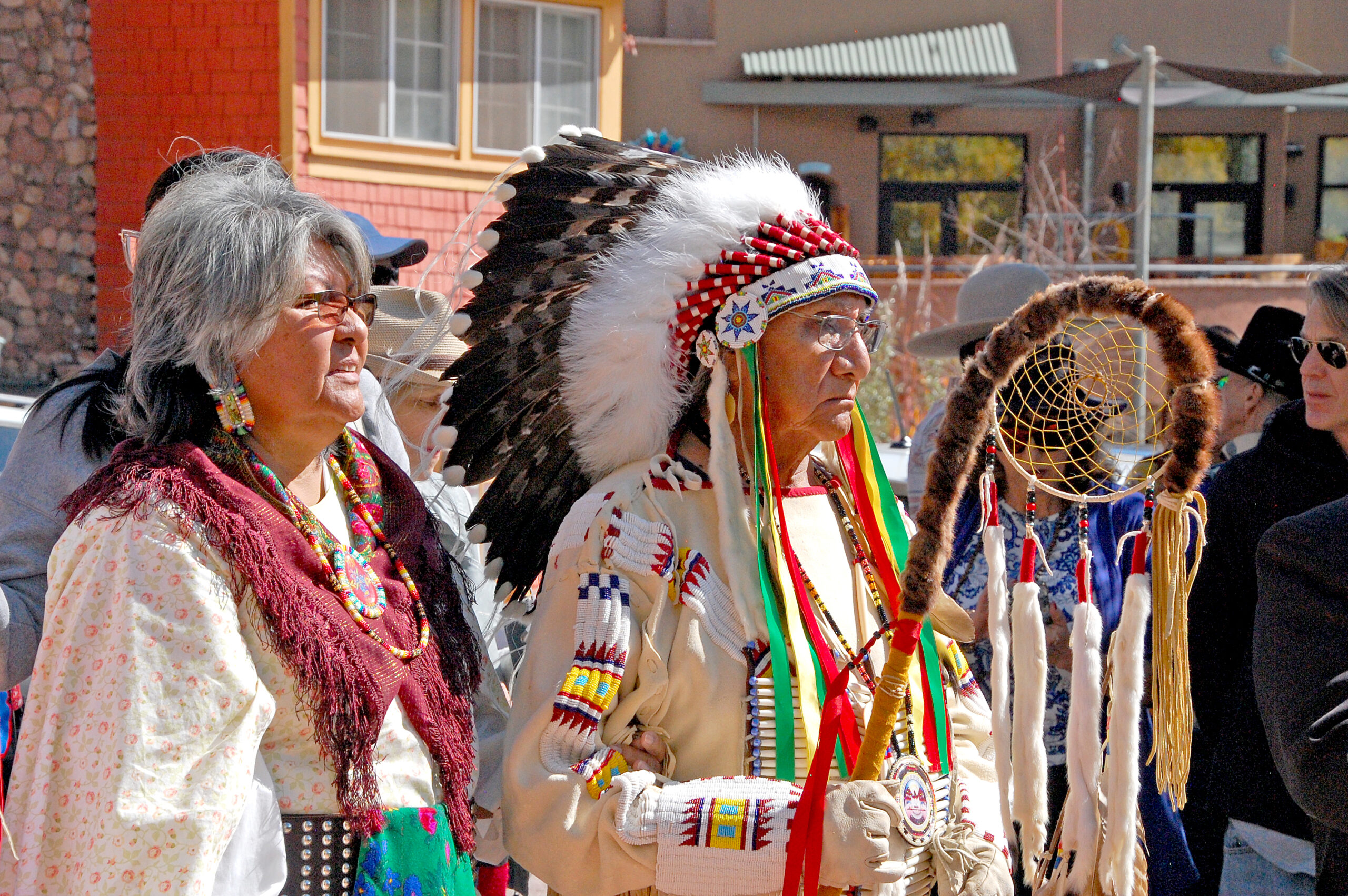 Photo by Rhonda Van Pelt. Joy Grant Bullethead and Jonas Grant Bullethead, Uncompahgre Utes, observe the blessing.