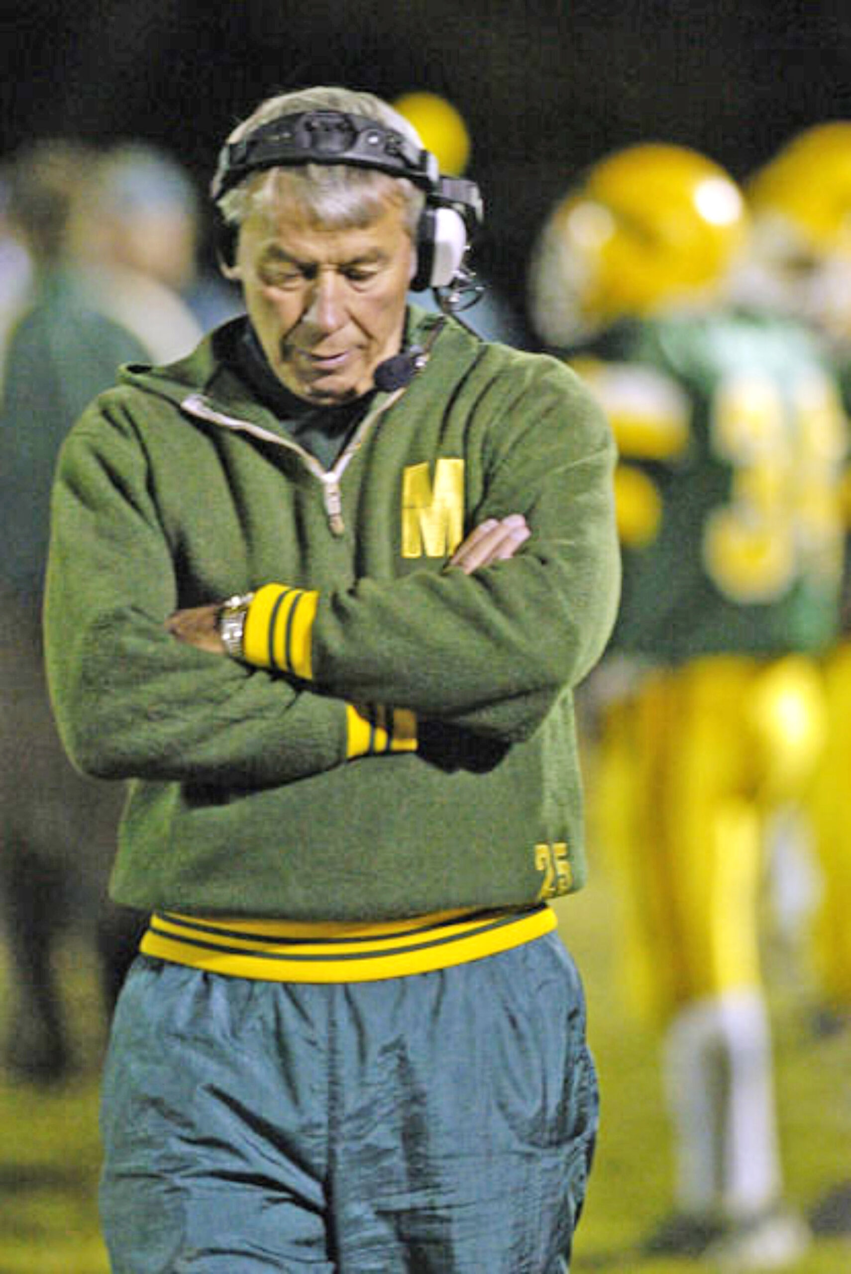 Courtesy image. Coach George Rykovich stands on the sidelines during a Manitou Springs High School football game.