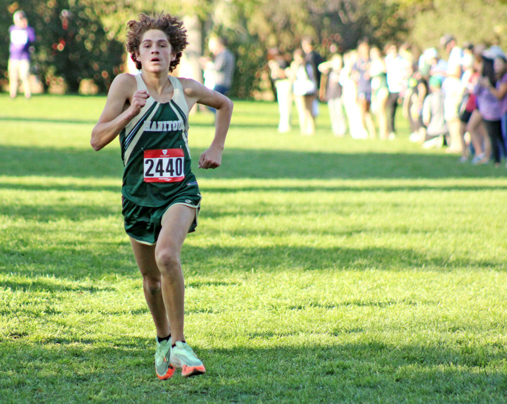 Photo by Daniel Mohrmann. Cody Kelley races toward the finish line during the regional cross-country race at Monument Valley Park on Oct. 20.