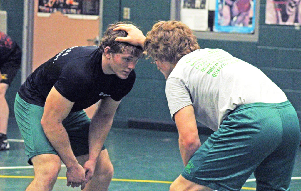 Photo by Daniel Mohrmann. Wesley Reeves, left, and Bradyn Dowling spar during wrestling practice on Nov. 14.