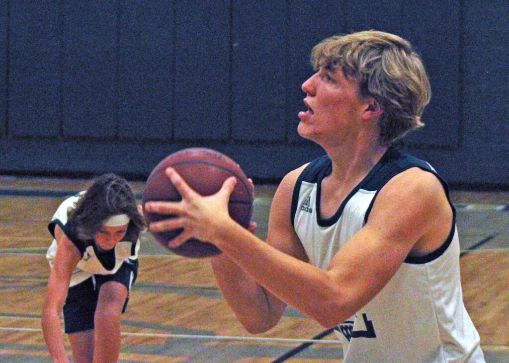 Photo by Daniel Mohrmann. Manitou junior Nate Gentzel sets up for a jump shot during boys basketball practice on Nov. 14.