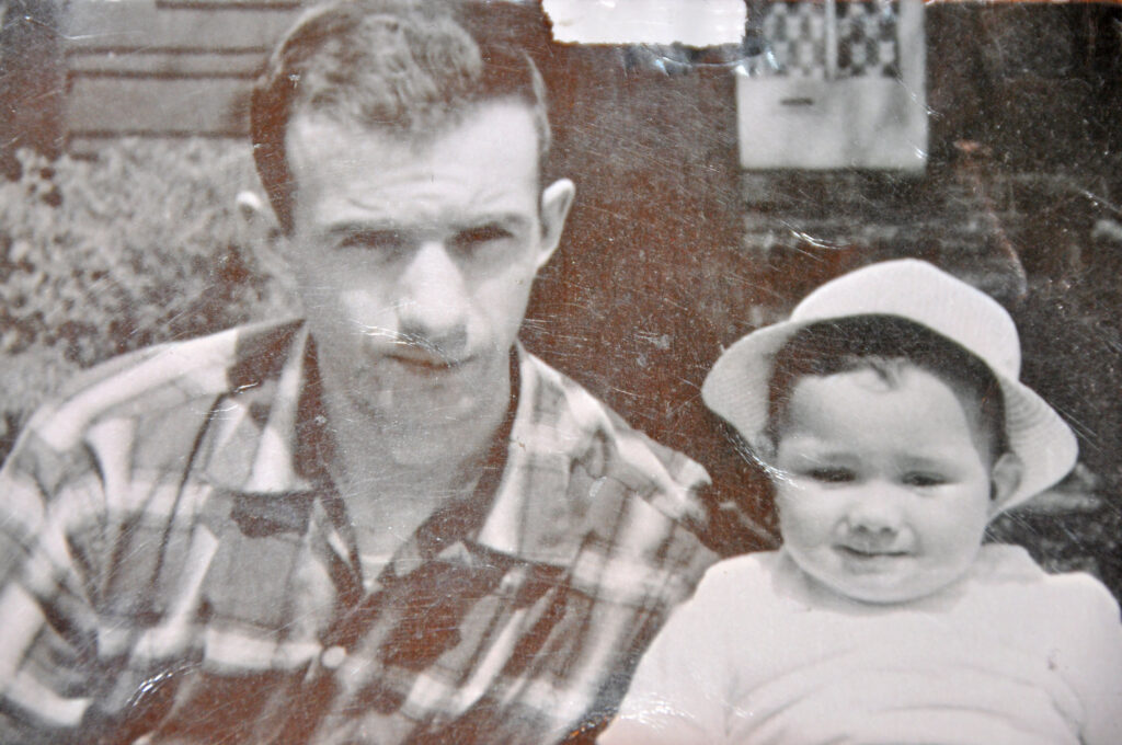 Courtesy image. William C. Dagendesh holds his 15 month-old son, William.