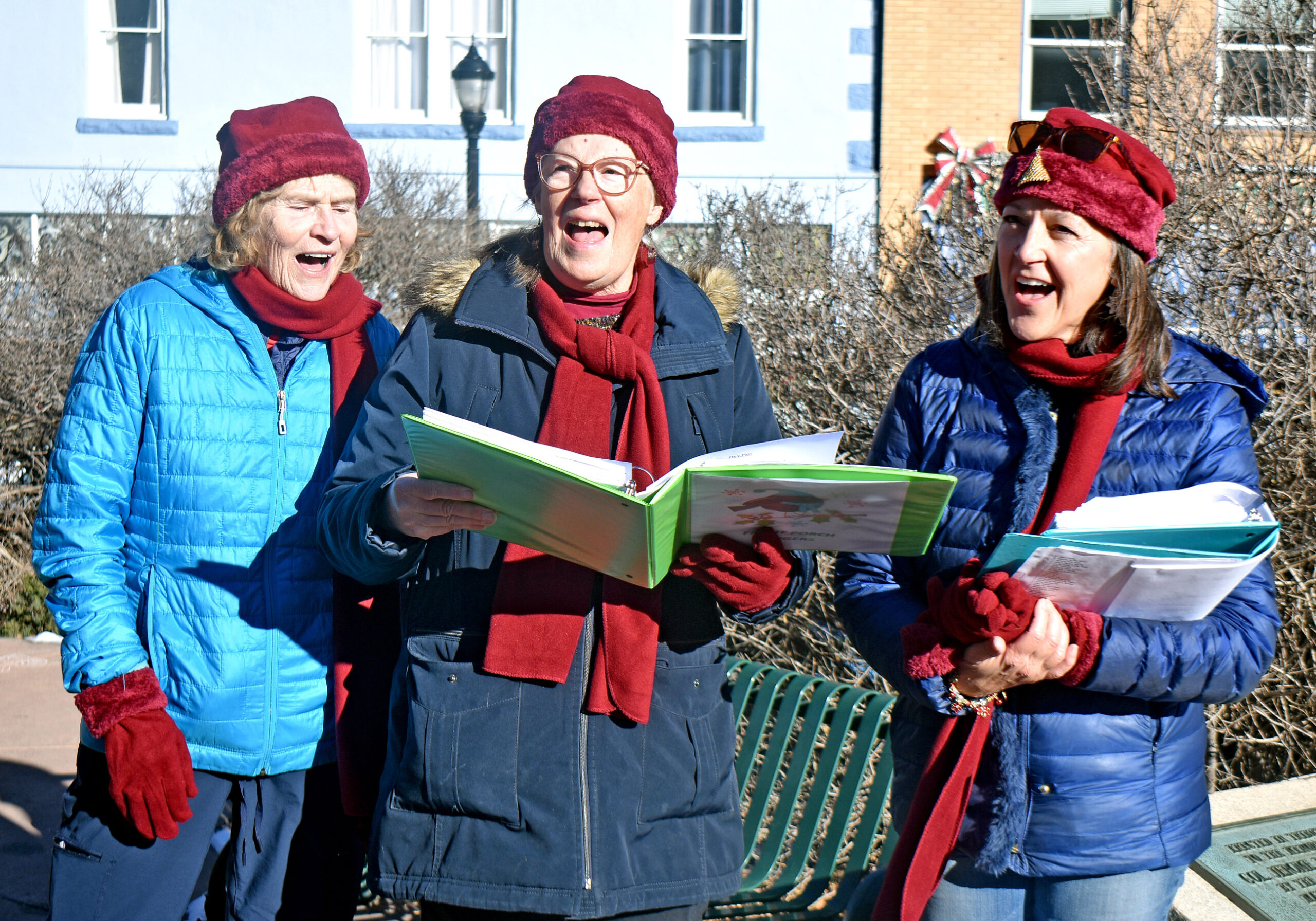 Photo by Rhonda Van Pelt. The Front Porch Singers serenade downtown shoppers on Saturday, Dec. 17. From left: Sue Graham, Nancy Fortuin and Jane Turnis. Member Ann Rodgers could not attend.